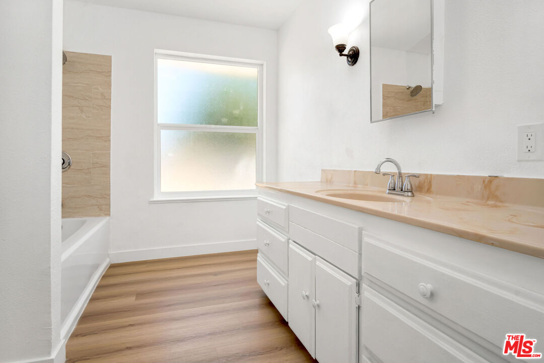 15376 Washoan Road Apple Valley, CA 92307 - Photo 24 of 40 a bathroom with a sink and a window