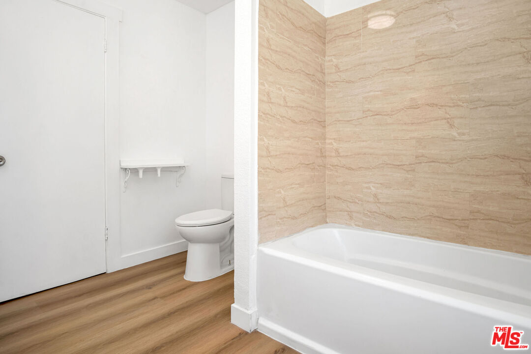 15376 Washoan Road Apple Valley, CA 92307 - Photo 25 of 40 a bathroom with a bathtub and toilet