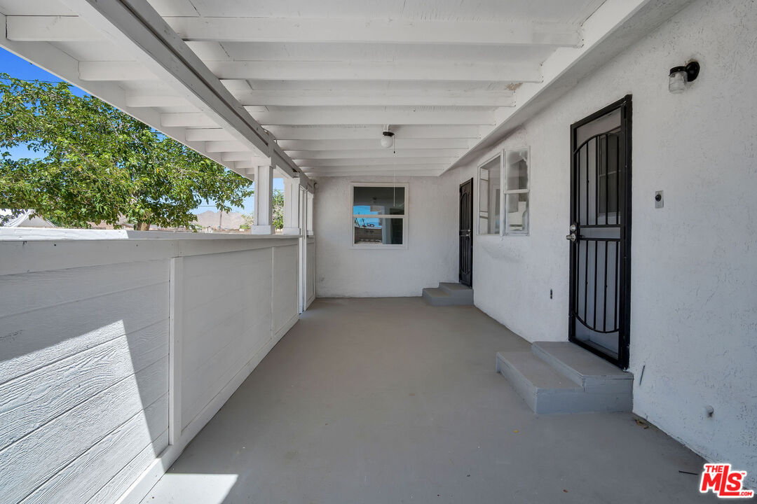 15376 Washoan Road Apple Valley, CA 92307 - Photo 35 of 40 a view of a house with a hallway