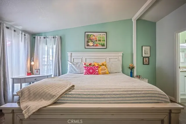 a view of a balcony with wooden floor and furniture