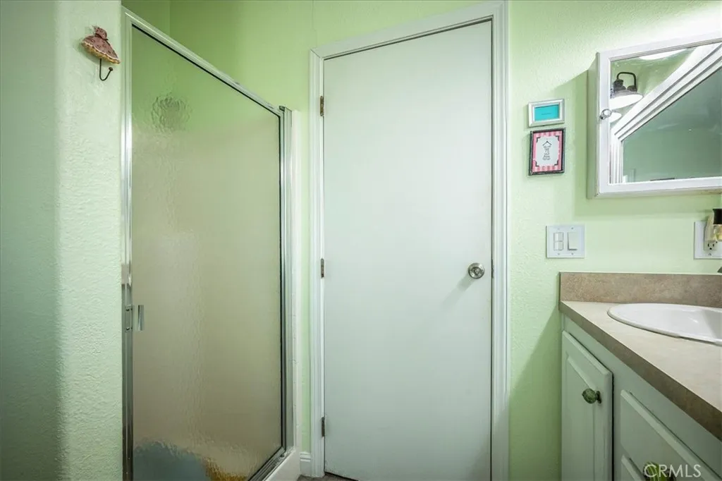 15181 Van Buren, Unit 178 Riverside, CA 92504 - Photo 20 of 52 a bathroom with a shower and a sink