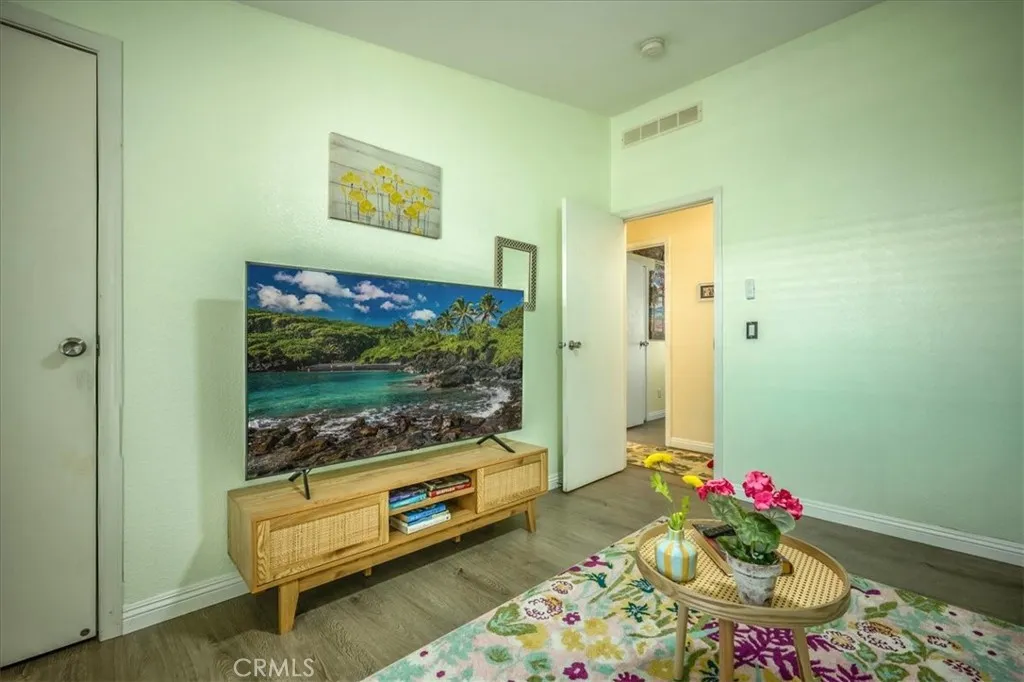 15181 Van Buren, Unit 178 Riverside, CA 92504 - Photo 23 of 52 a living room with furniture and a floor to ceiling window