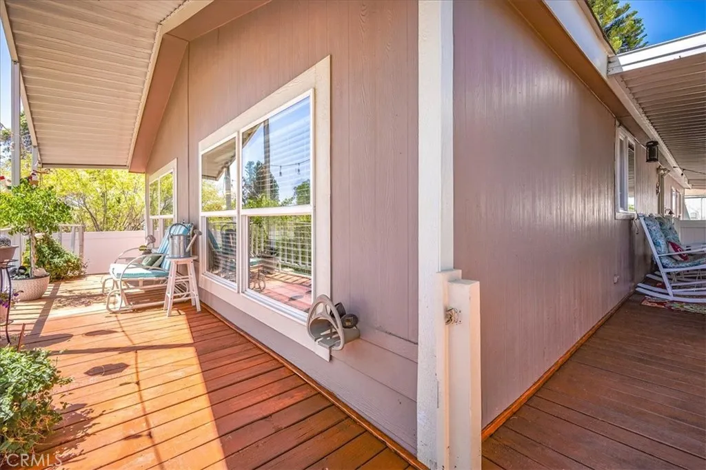 15181 Van Buren, Unit 178 Riverside, CA 92504 - Photo 27 of 52 a view of a balcony with wooden floor and furniture