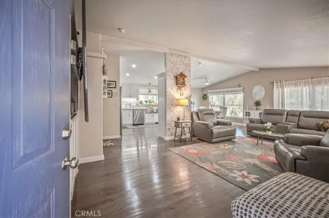 a living room with furniture and a rug