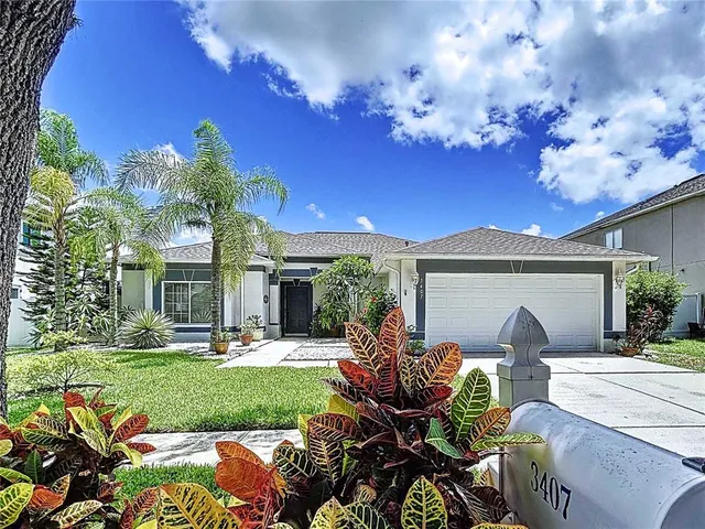a view of a patio with couches table and chairs and potted plants
