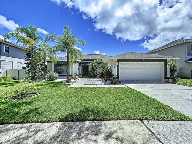 a kitchen with a refrigerator a stove top oven and cabinets