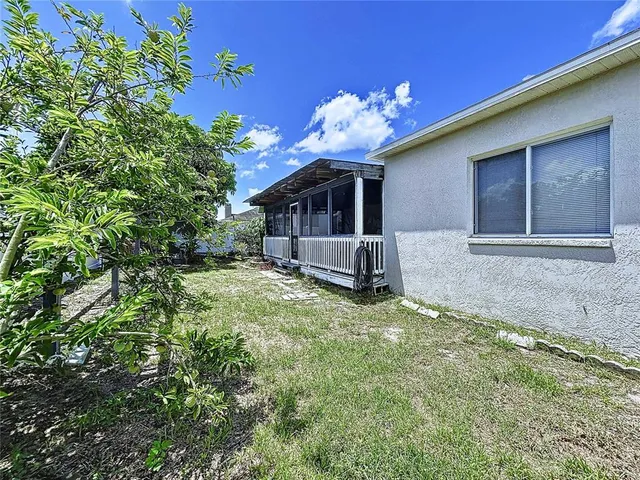 a living room with furniture large window and wooden floor