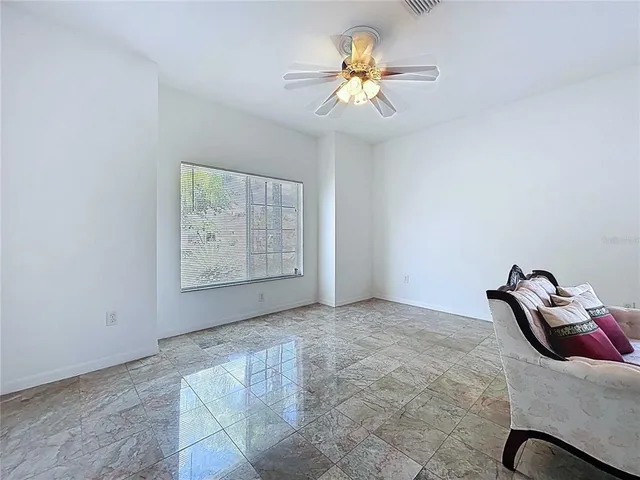 an aerial view of a house with a garden and a car parked