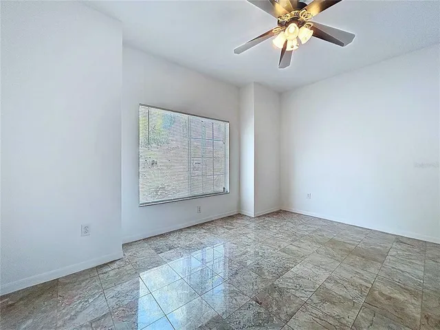 an aerial view of a house with a yard and potted plants