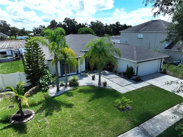 a view of an empty room with window and bathroom