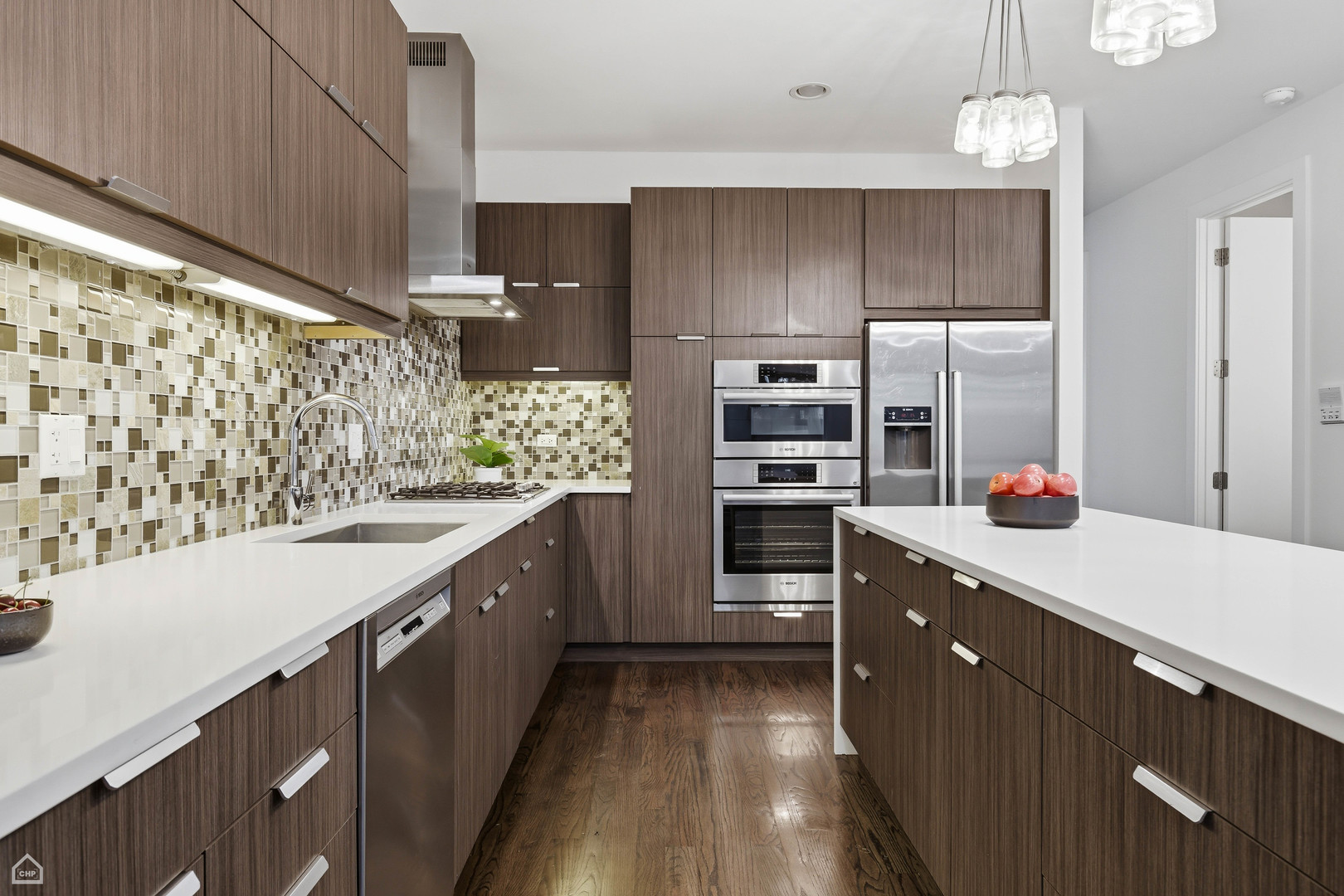 Undisclosed Address Chicago, IL 60622 - Photo 4 of 21 a kitchen with stainless steel appliances a sink and a refrigerator