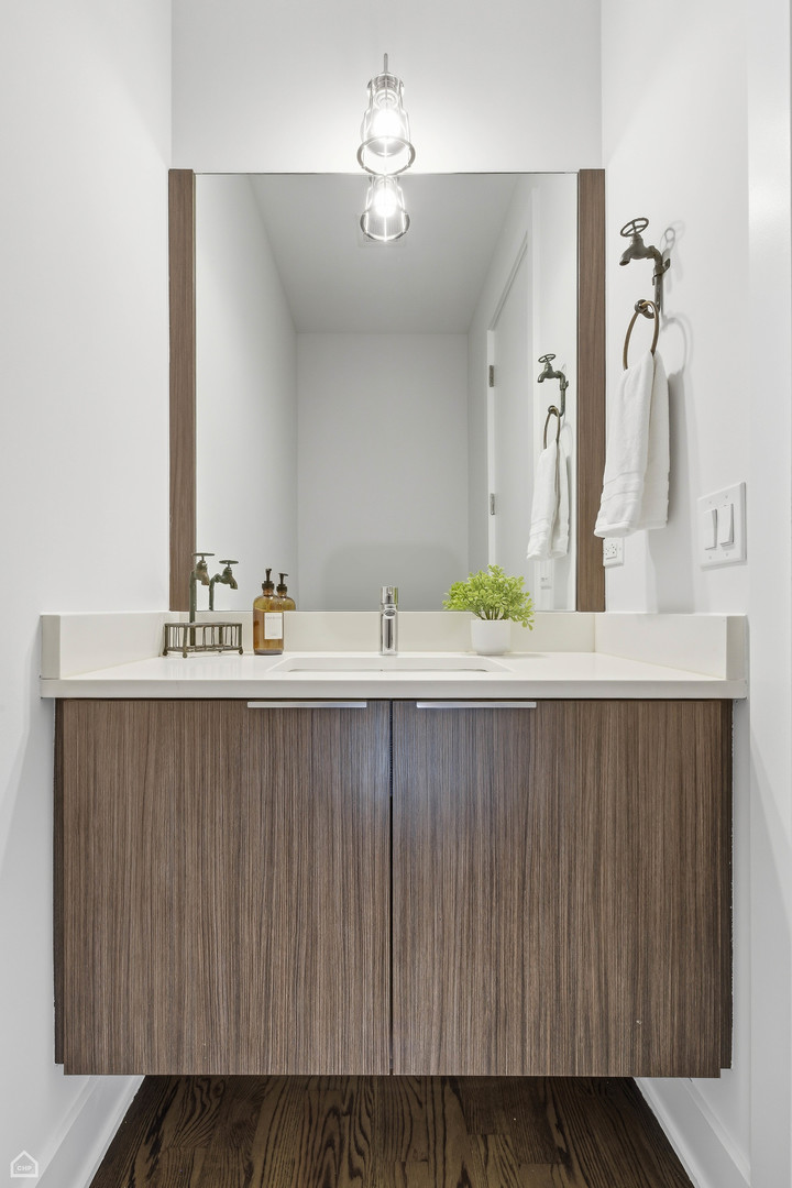 Undisclosed Address Chicago, IL 60622 - Photo 6 of 21 a bathroom with a sink and a mirror