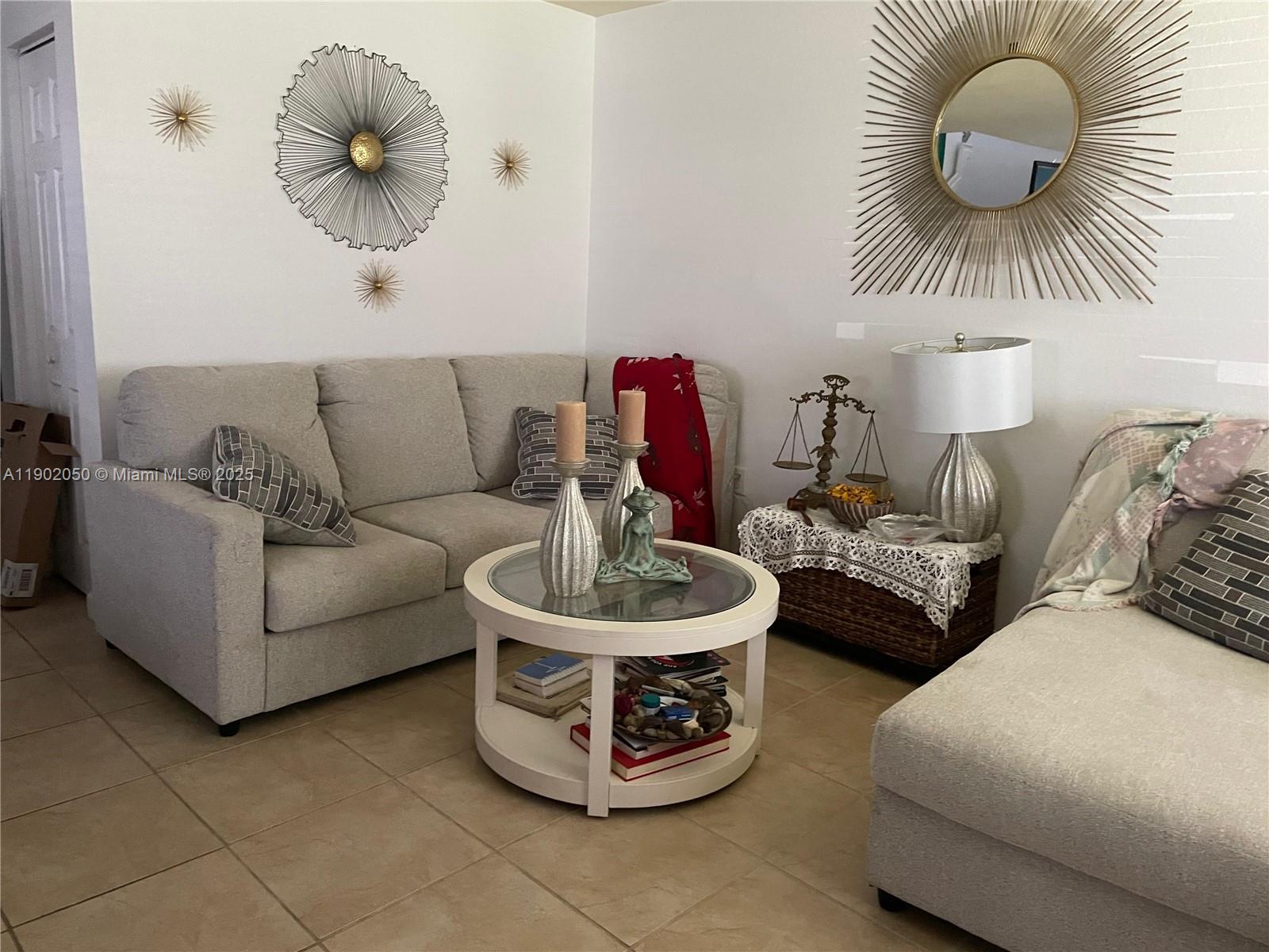 22411 Southwest 88th Place, Unit 926 Cutler Bay, FL 33190 - Photo 15 of 16 a living room with furniture and a large window