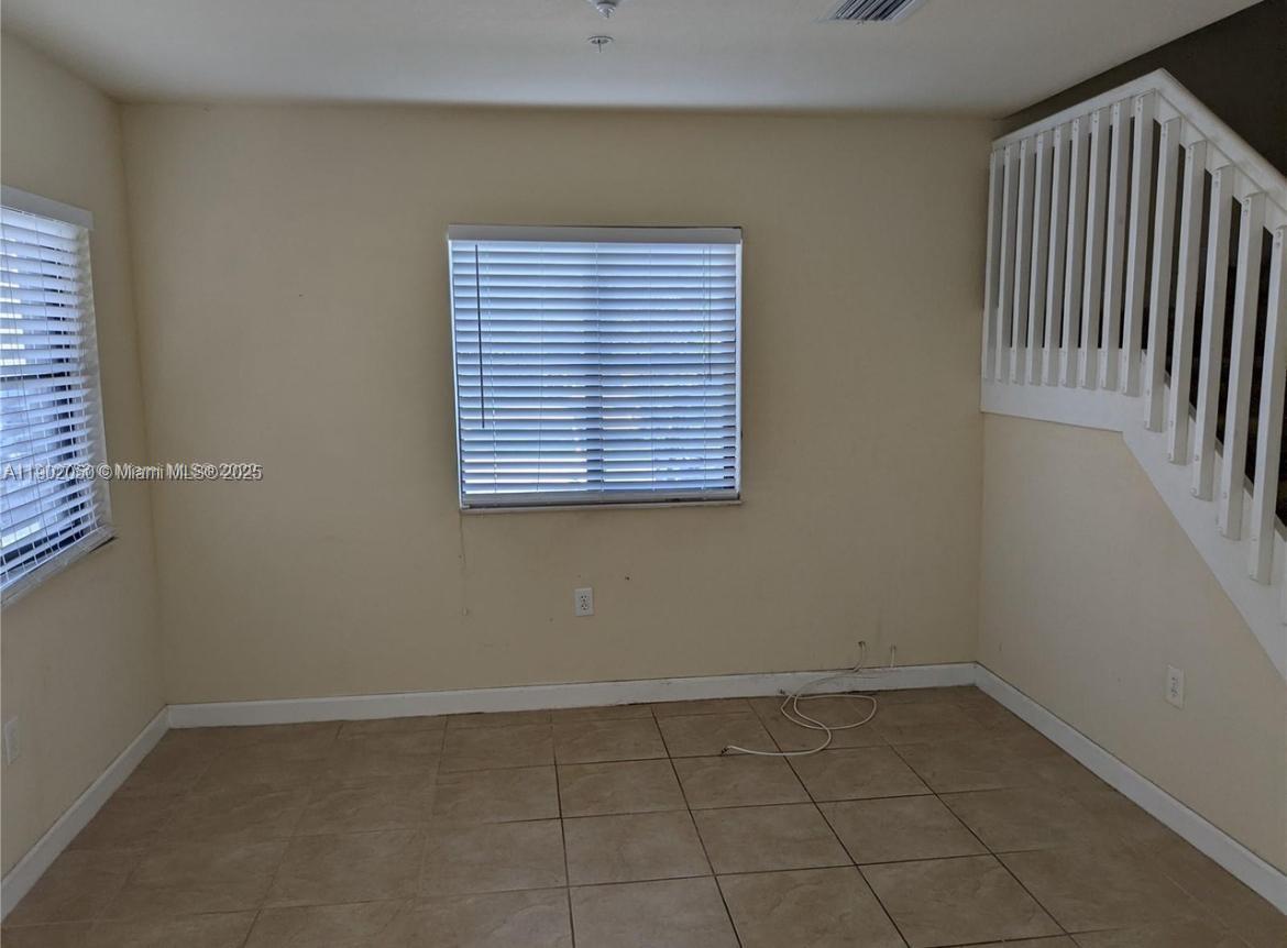 22411 Southwest 88th Place, Unit 926 Cutler Bay, FL 33190 - Photo 3 of 16 an empty room with a window
