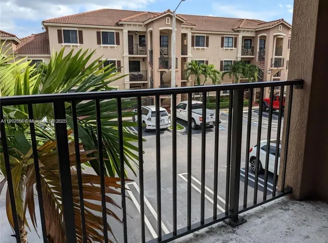 a view of a house with wooden fence