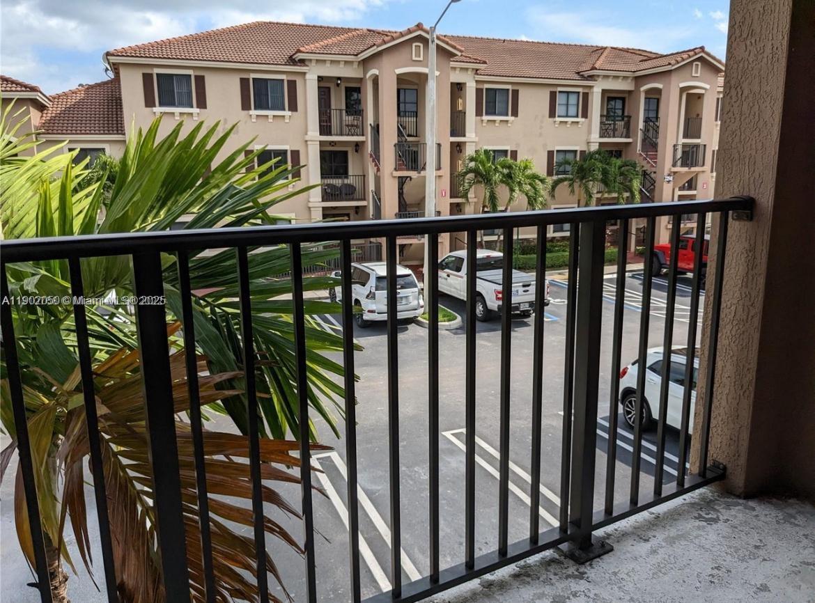 22411 Southwest 88th Place, Unit 926 Cutler Bay, FL 33190 - Photo 5 of 16 a view of a house with wooden fence