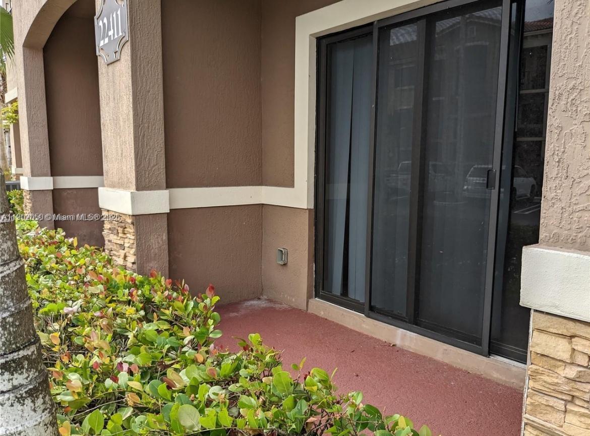 22411 Southwest 88th Place, Unit 926 Cutler Bay, FL 33190 - Photo 9 of 16 a front view of a house
