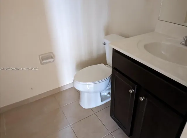 a bathroom with a sink and toilet