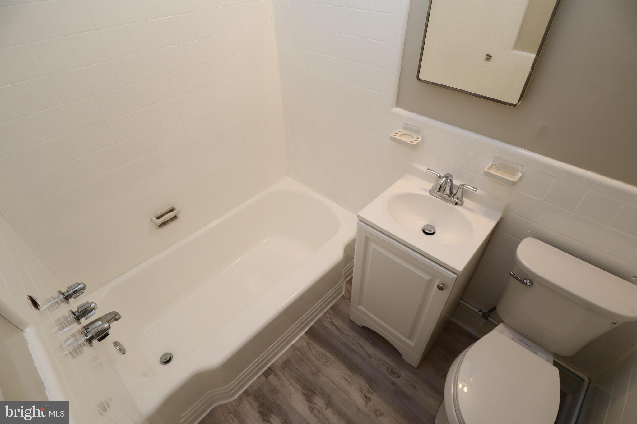 6335 Carnation Street, Unit 2 Philadelphia, PA 19144 - Photo 19 of 35 a bathroom with a sink toilet and tub