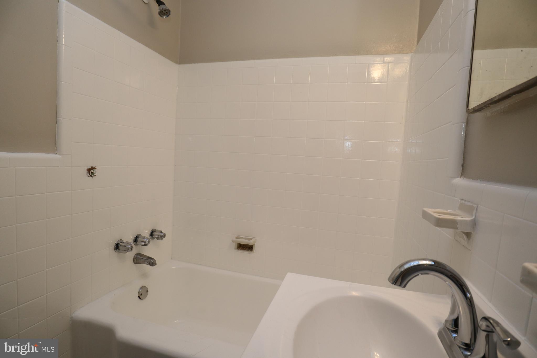 6335 Carnation Street, Unit 2 Philadelphia, PA 19144 - Photo 20 of 35 a bathroom with a sink and a tub