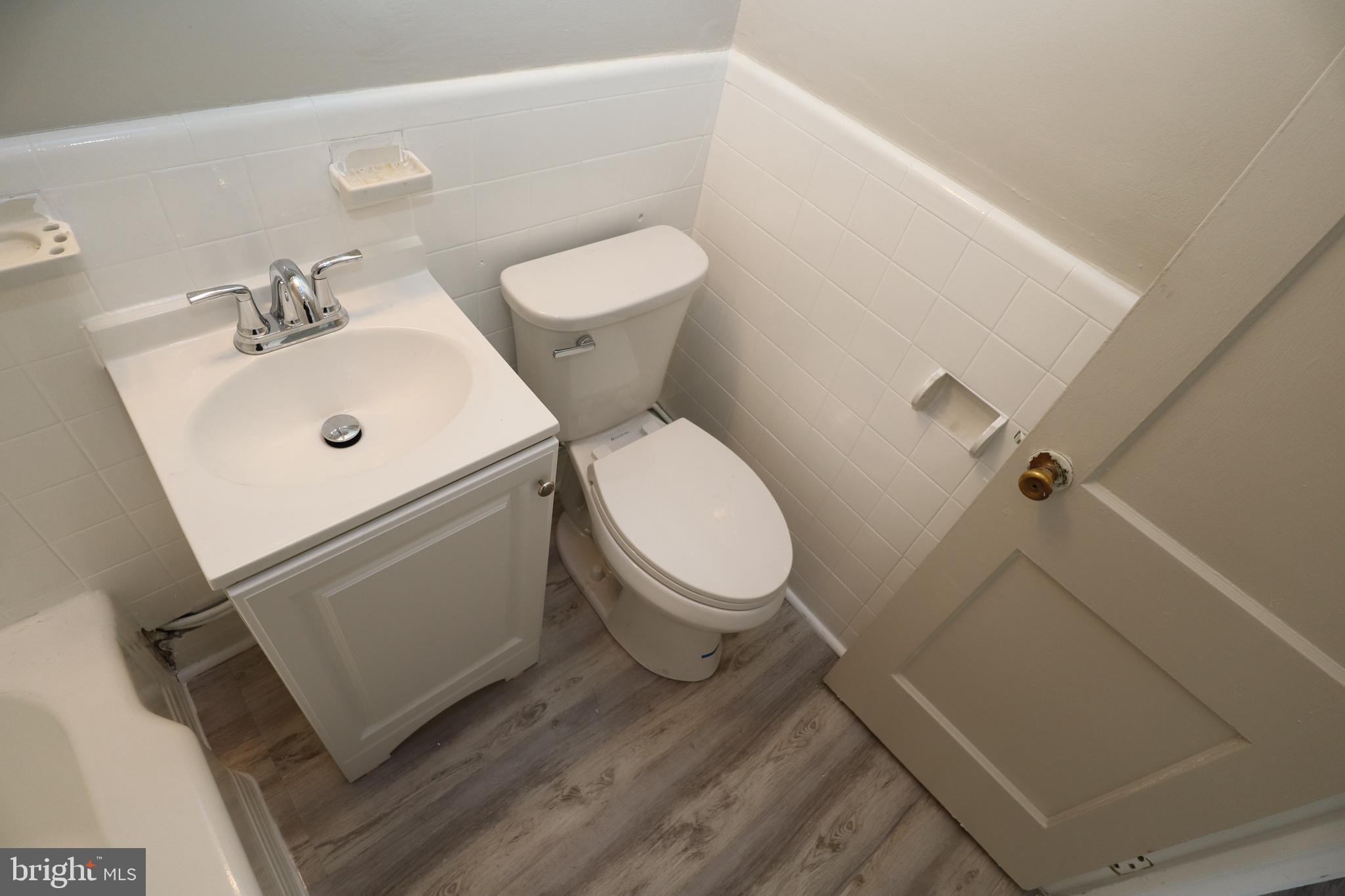 6335 Carnation Street, Unit 2 Philadelphia, PA 19144 - Photo 21 of 35 a white toilet sitting next to a white sink