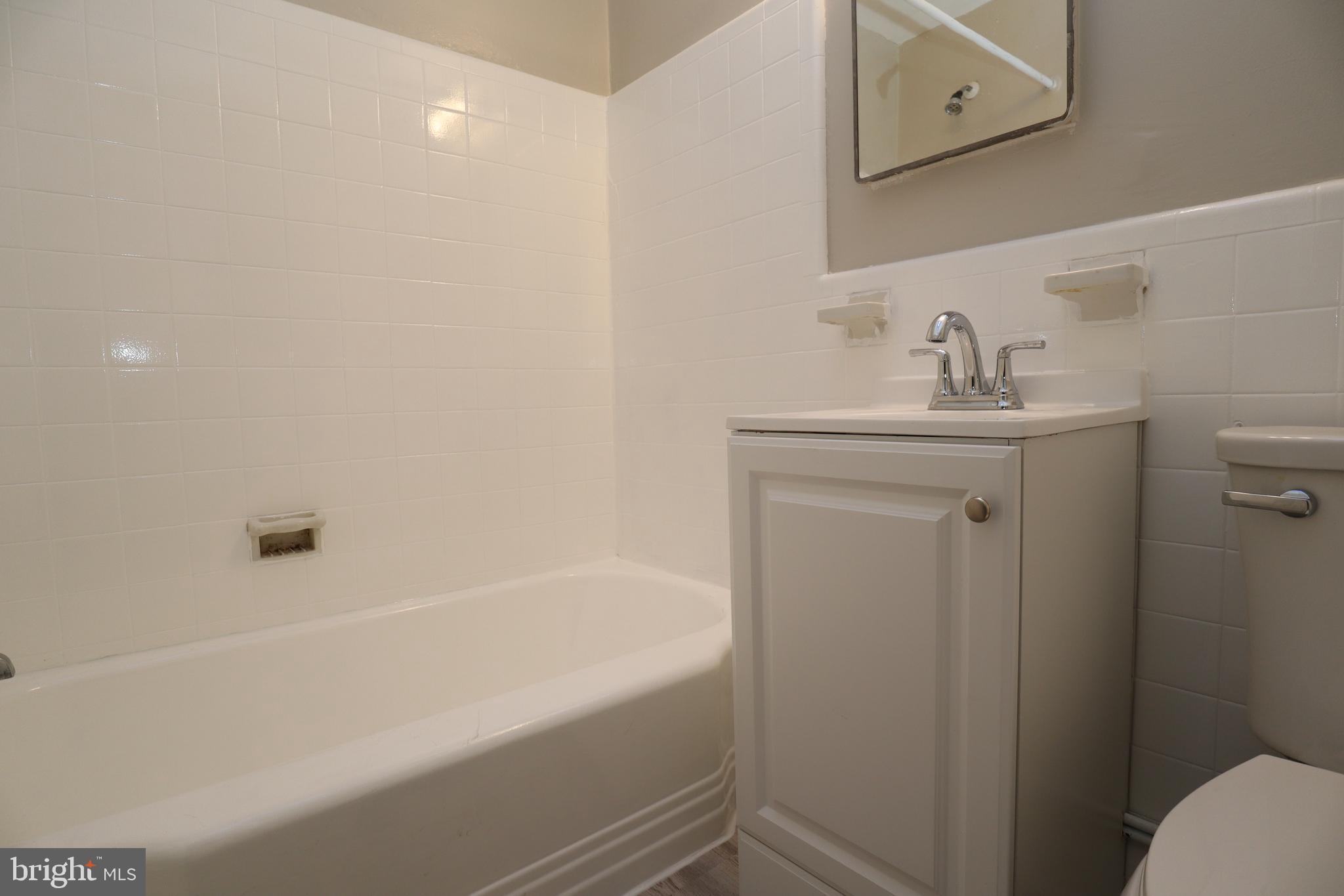 6335 Carnation Street, Unit 2 Philadelphia, PA 19144 - Photo 22 of 35 a bathroom with a sink and a mirror