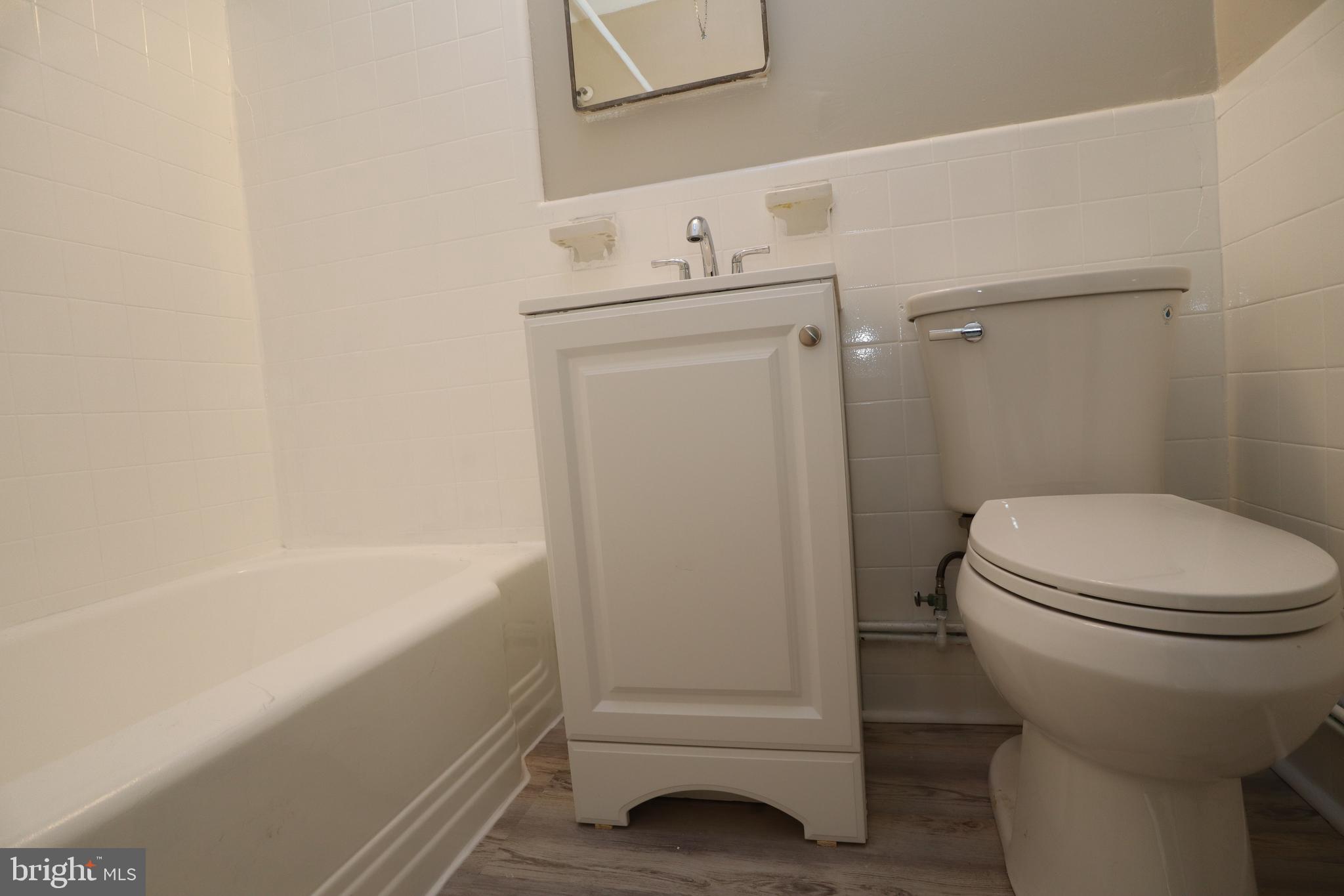 6335 Carnation Street, Unit 2 Philadelphia, PA 19144 - Photo 23 of 35 a bathroom with a sink a toilet and shower