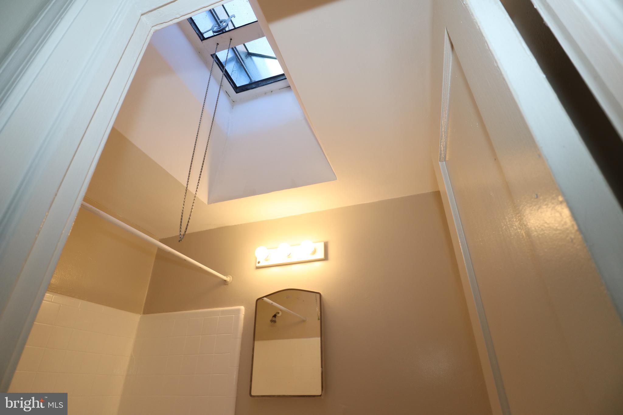 6335 Carnation Street, Unit 2 Philadelphia, PA 19144 - Photo 24 of 35 a bathroom with a sink and mirror