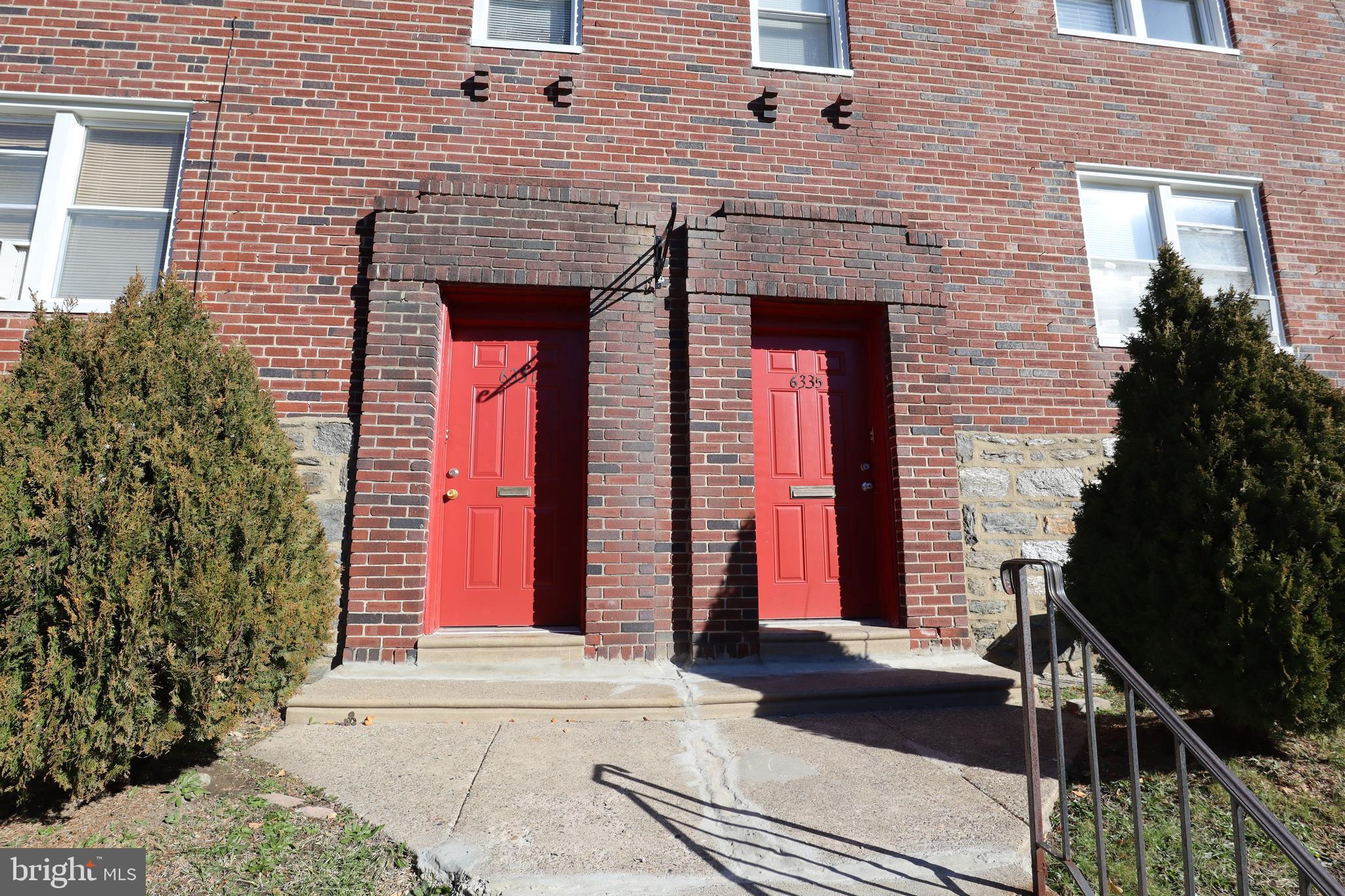 6335 Carnation Street, Unit 2 Philadelphia, PA 19144 - Photo 32 of 35 a front view of a house with a yard
