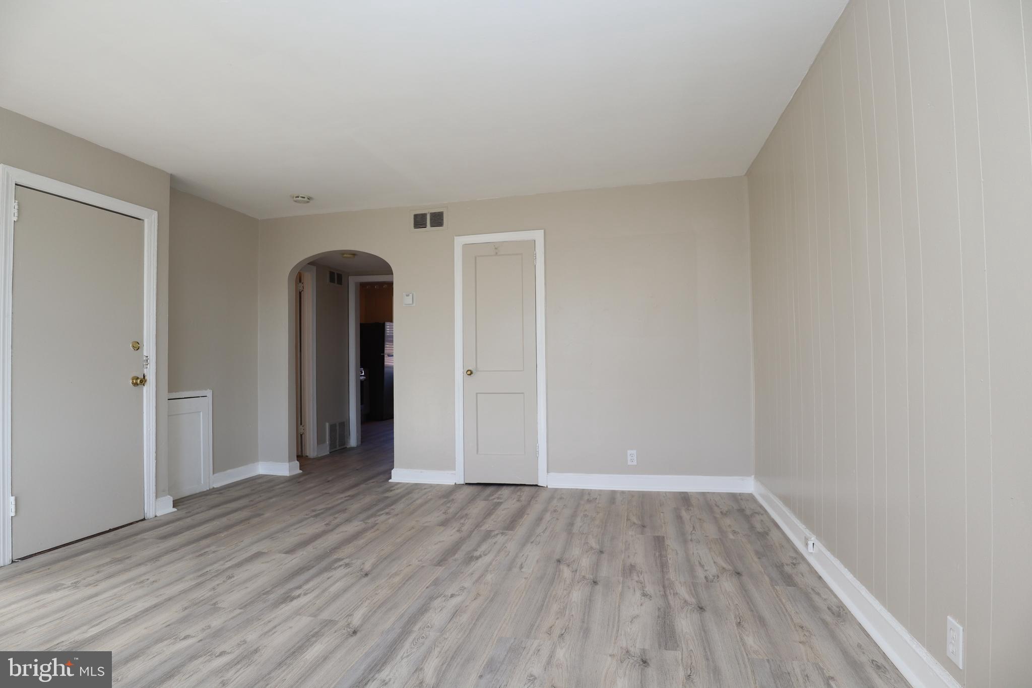 6335 Carnation Street, Unit 2 Philadelphia, PA 19144 - Photo 6 of 35 a view of empty room with wooden floor and fan