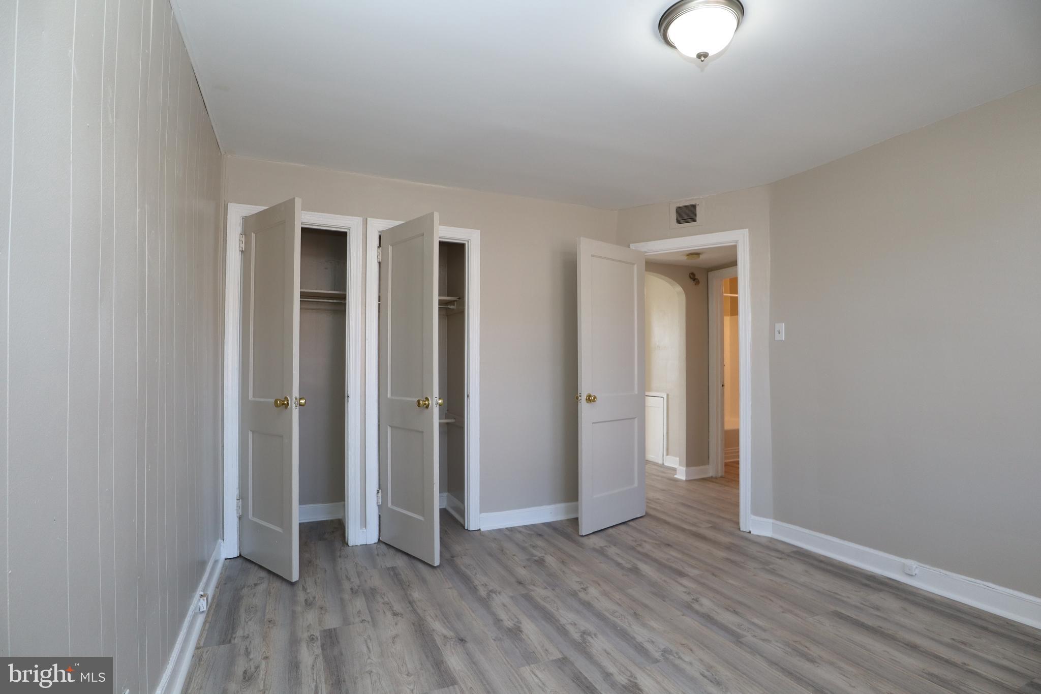 6335 Carnation Street, Unit 2 Philadelphia, PA 19144 - Photo 10 of 35 an empty room with closet and wooden floor