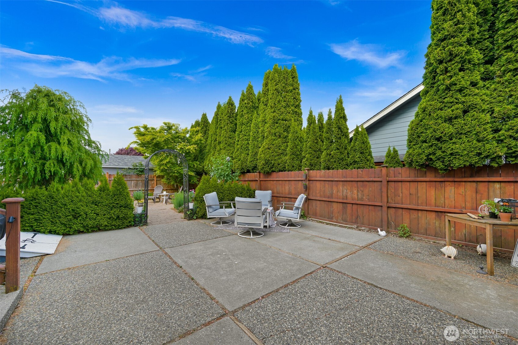 8490 Benson Road Lynden, WA 98264 - Photo 29 of 40 a view of backyard with outdoor seating and plants