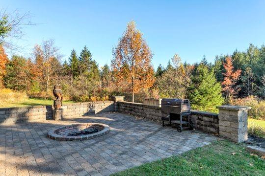 226 Ashbaugh Road Jeannette, PA 15644 - Photo 17 of 25 a view of a backyard with lawn chairs plants and trees