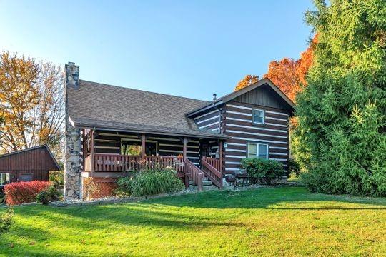 226 Ashbaugh Road Jeannette, PA 15644 - Photo 3 of 25 a front view of a house with a garden