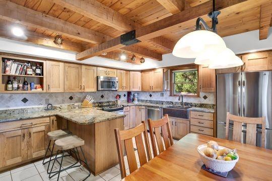 226 Ashbaugh Road Jeannette, PA 15644 - Photo 6 of 25 a kitchen with sink a stove and chairs
