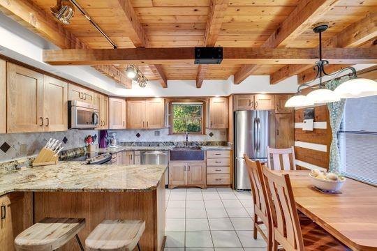 226 Ashbaugh Road Jeannette, PA 15644 - Photo 7 of 25 a kitchen with stainless steel appliances granite countertop a sink and cabinets