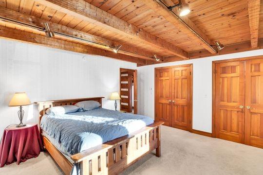226 Ashbaugh Road Jeannette, PA 15644 - Photo 9 of 25 a bedroom with a bed and a lamp