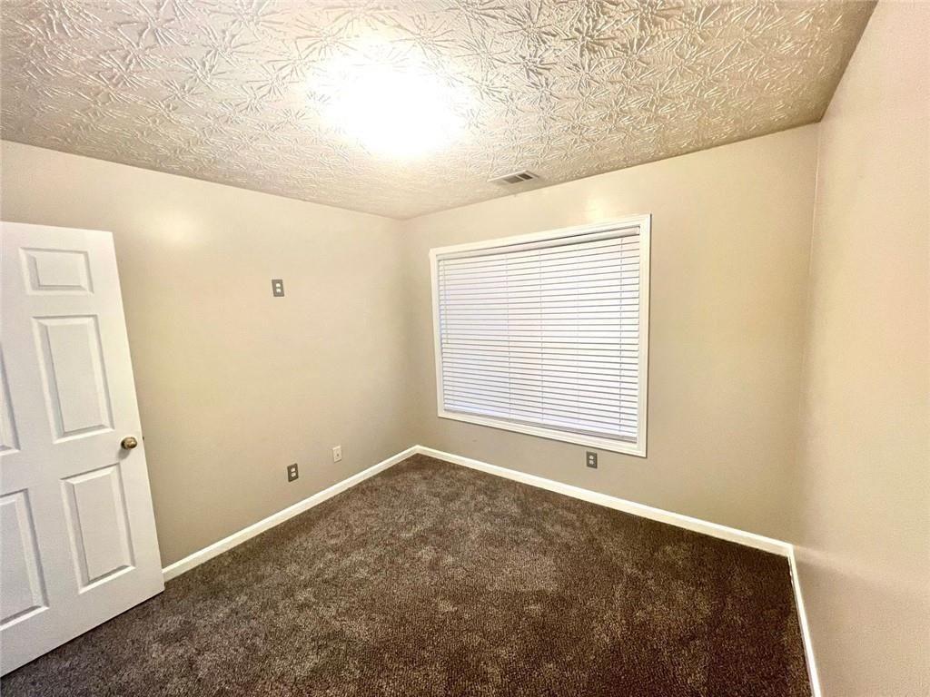 3854 Austin Park Lane Decatur, GA 30032 - Photo 35 of 44 a view of an empty room with a window