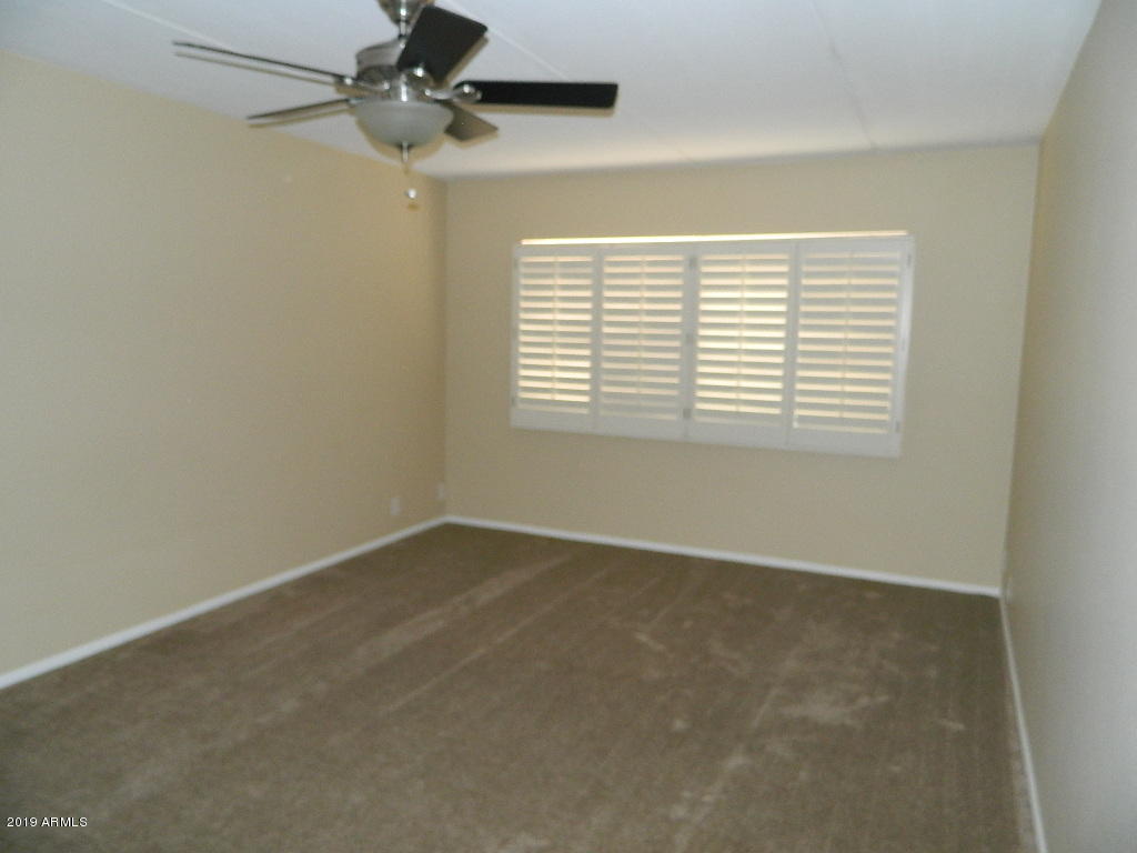 7830 East Camelback Road, Unit 212 Scottsdale, AZ 85251 - Photo 19 of 45 an empty room with a window
