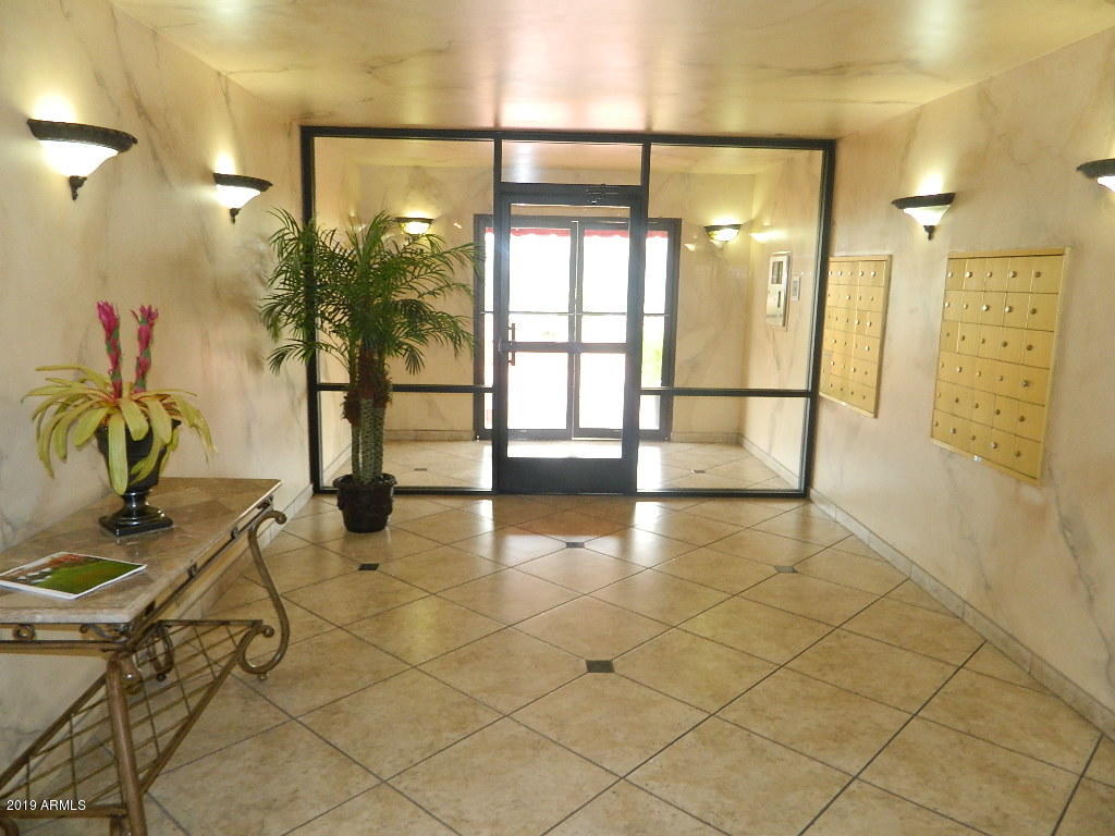 7830 East Camelback Road, Unit 212 Scottsdale, AZ 85251 - Photo 25 of 45 a view of a entryway with wooden floor