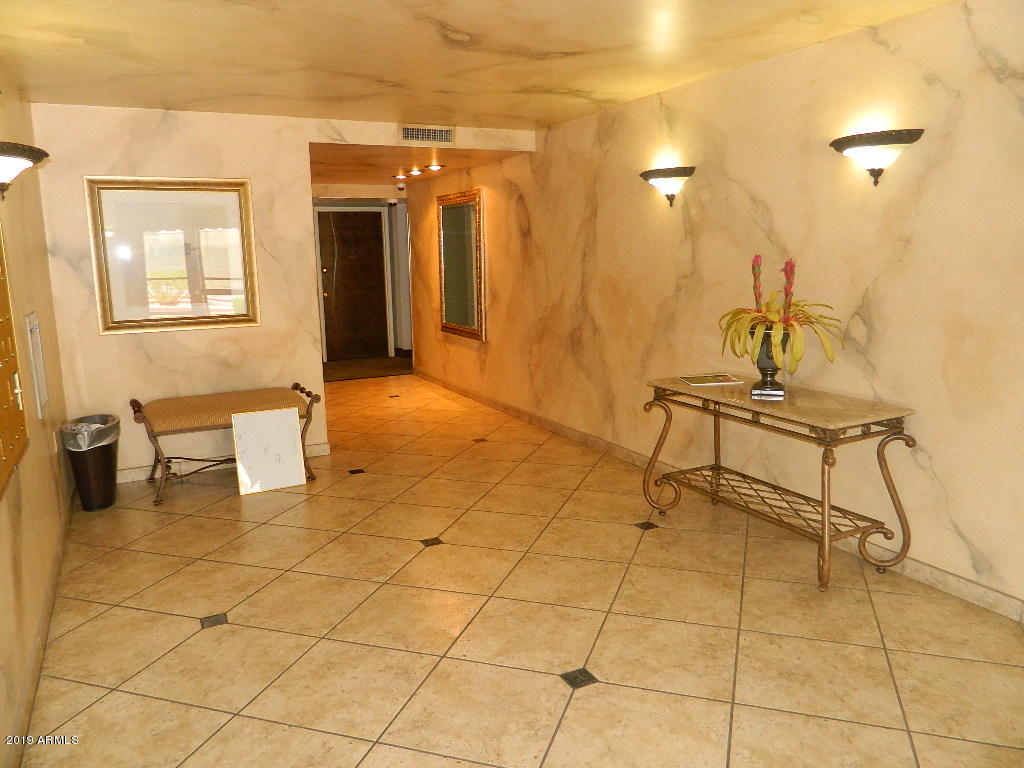 7830 East Camelback Road, Unit 212 Scottsdale, AZ 85251 - Photo 27 of 45 a view of a room with table and chair