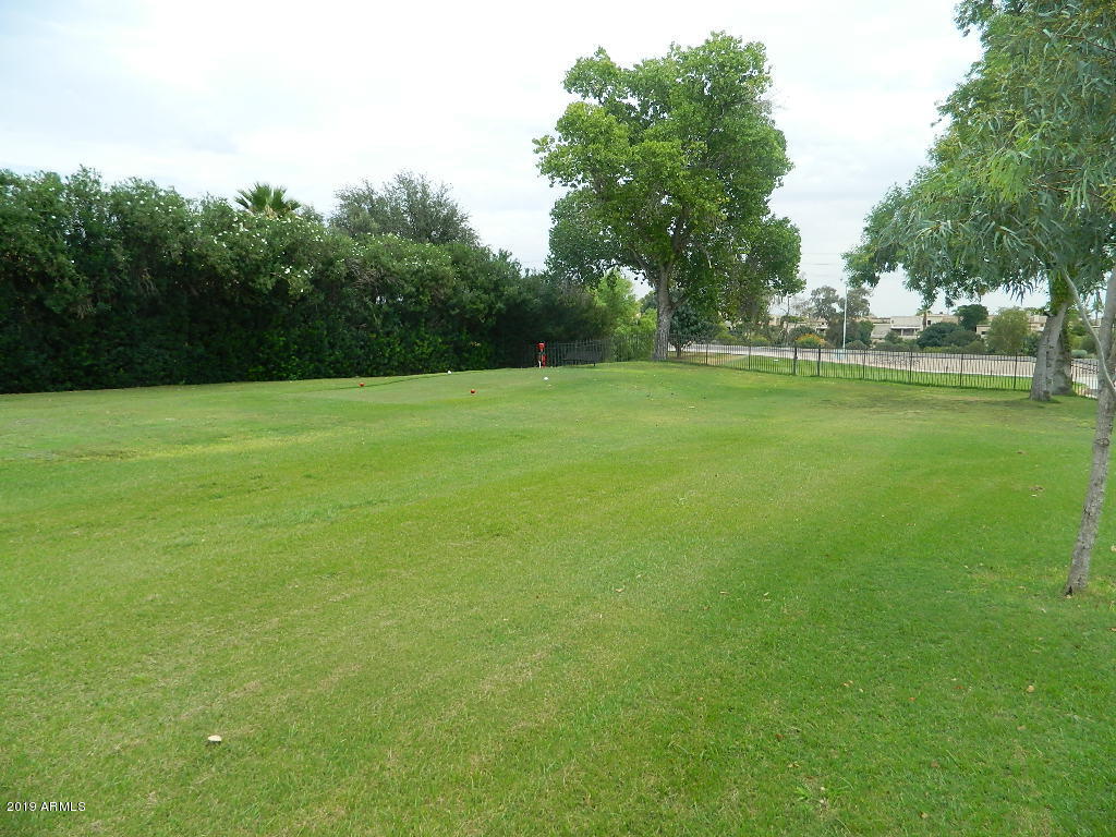 7830 East Camelback Road, Unit 212 Scottsdale, AZ 85251 - Photo 33 of 45 a view of field with trees in the background