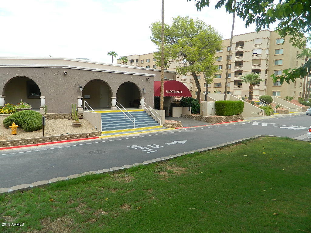 7830 East Camelback Road, Unit 212 Scottsdale, AZ 85251 - Photo 42 of 45 a view of the street with big building and large trees
