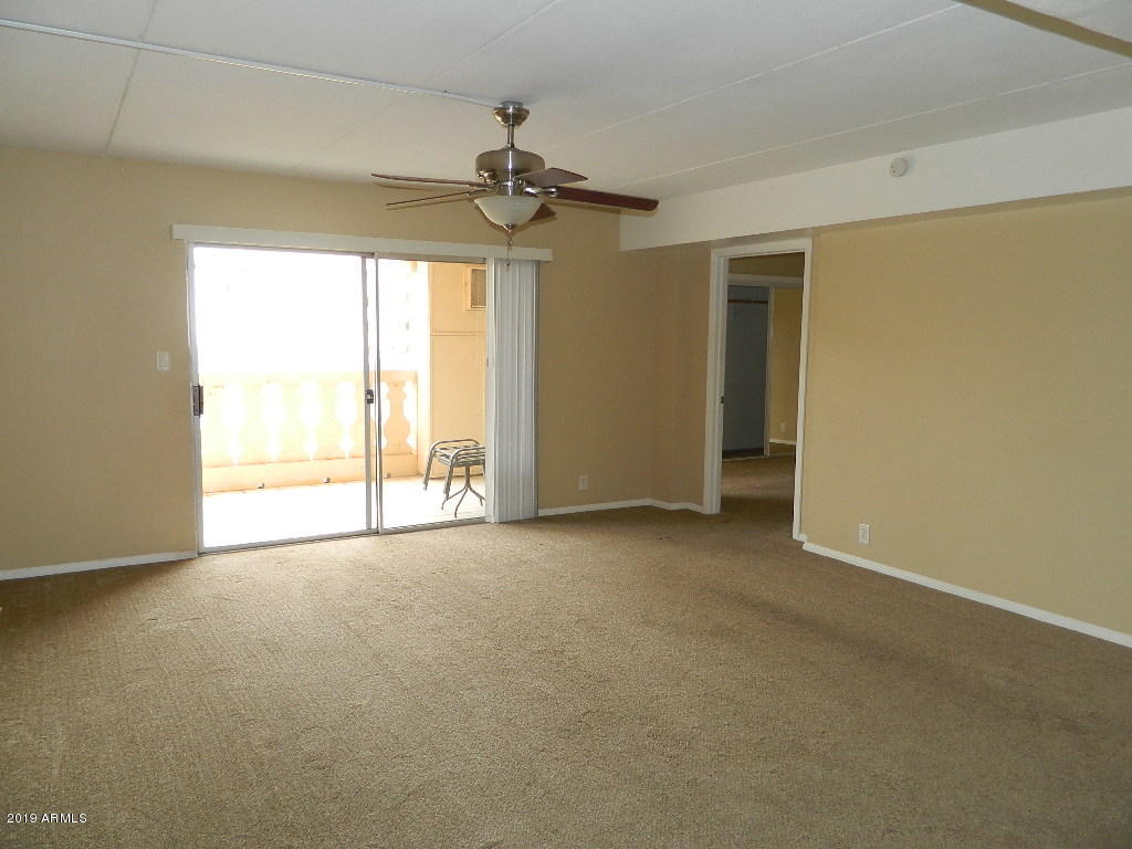 7830 East Camelback Road, Unit 212 Scottsdale, AZ 85251 - Photo 6 of 45 a view of an empty room with a window