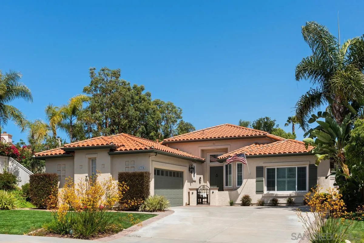 1374 Sparrow Road Carlsbad, CA 92011 - Photo 1 of 33 a front view of a house with garden