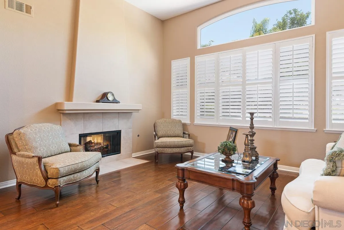 1374 Sparrow Road Carlsbad, CA 92011 - Photo 7 of 33 a living room with furniture and a fireplace