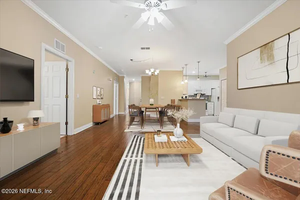 a view of a dining room with furniture and wooden floor