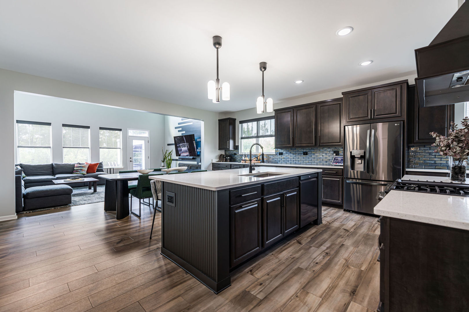 16230 Lake View Road Plainfield, IL 60586 - Photo 19 of 62 a kitchen with stainless steel appliances granite countertop a stove a sink dishwasher a refrigerator and a dining table with wooden floor