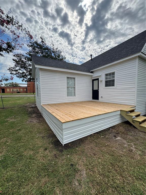 306 North College Street Howe, TX 75459 - Photo 12 of 15 a view of a backyard with a garden