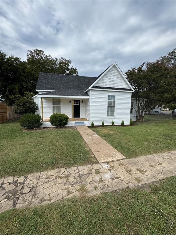 306 North College Street Howe, TX 75459 - Photo 15 of 15 a front view of house with yard and green space
